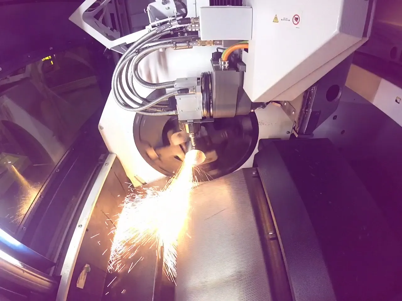 Tube laser cutting in progress
